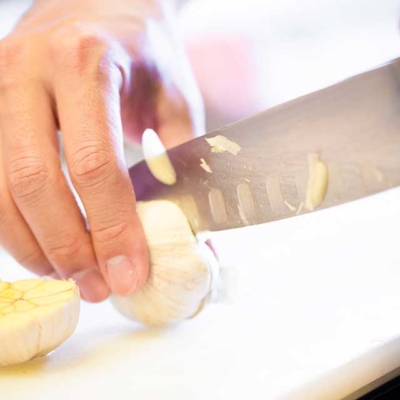 Kitchen image of RAKKAN RAMEN, Cutting garlic
